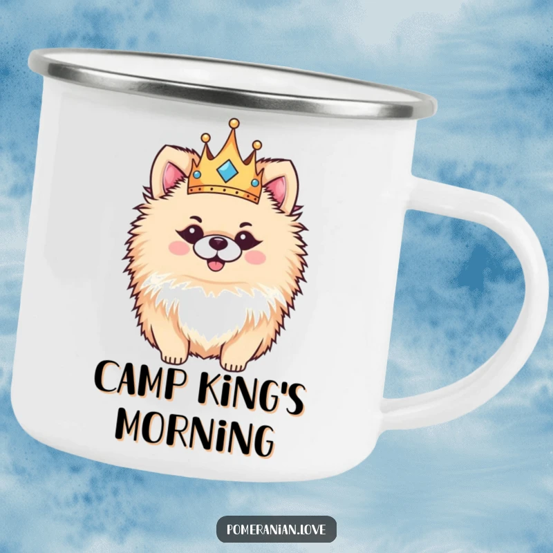 Funny Pomeranian camping mug, a portrait of a fluffy dog wearing a small crown, looking regal and happy in an outdoor setting.