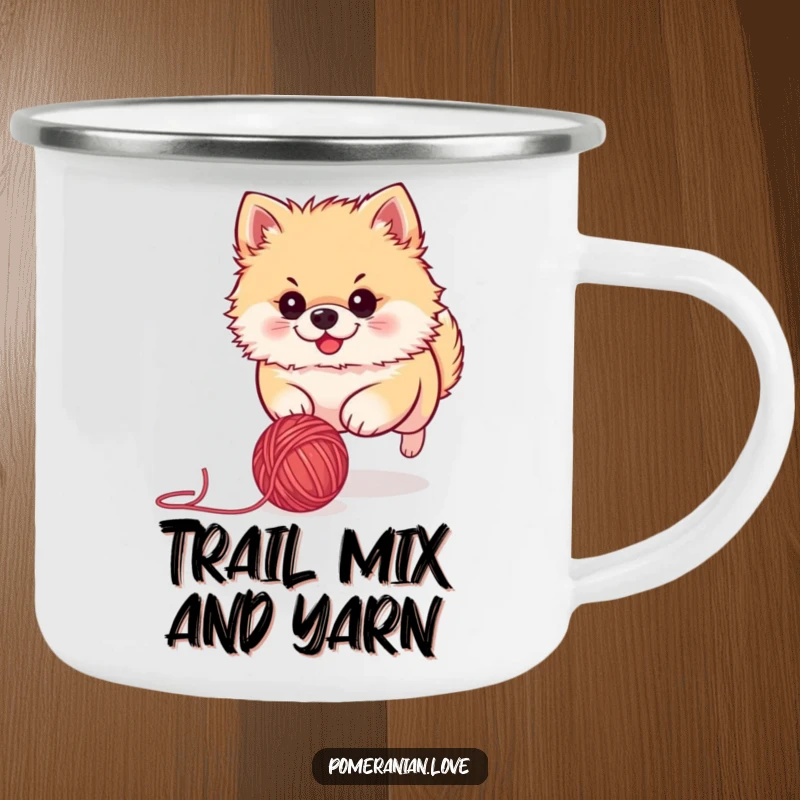 Funny Pomeranian camping mug showing a determined dog chasing a ball of yarn, designed for outdoor enthusiasts and dog lovers.