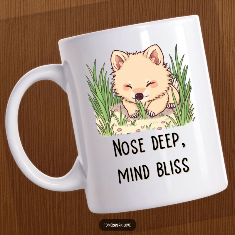 Funny Pomeranian mug, a fluffy dog joyfully digging its nose into soft green grass, capturing playful delight.