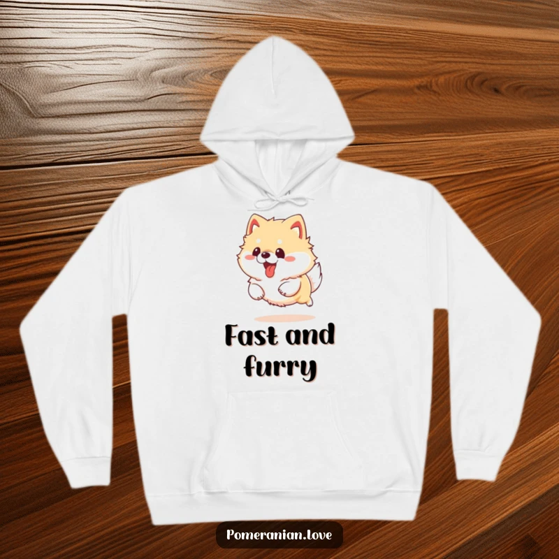 Funny Pomeranian dog running with its tongue out, depicted on a cozy hoodie, radiating pure playful energy.