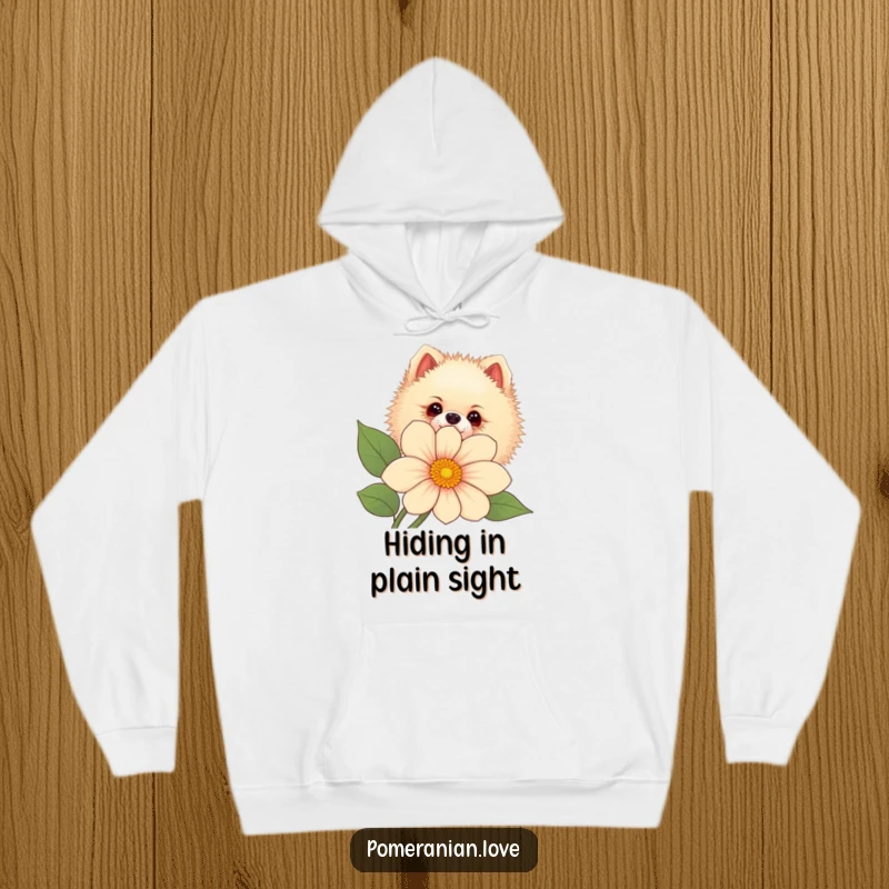 Funny Pomeranian dog peeking curiously from behind a large flower, printed on a comfortable hoodie.