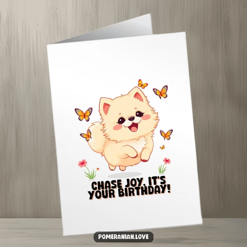 Funny Free Printable Birthday Card: A happy Pomeranian dog delightedly chasing colorful butterflies in a meadow.