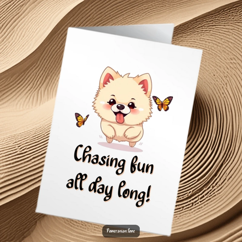 Funny Free Printable Birthday Card of a silly Pomeranian with its tongue sticking out, joyfully chasing a butterfly in a playful pursuit.
