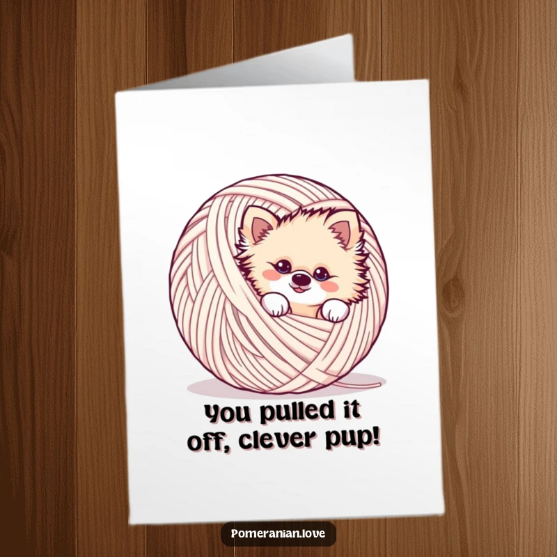 Funny Free Printable Congratulations Card showing a mischievous Pomeranian dog peeking out from behind a giant ball of yarn.