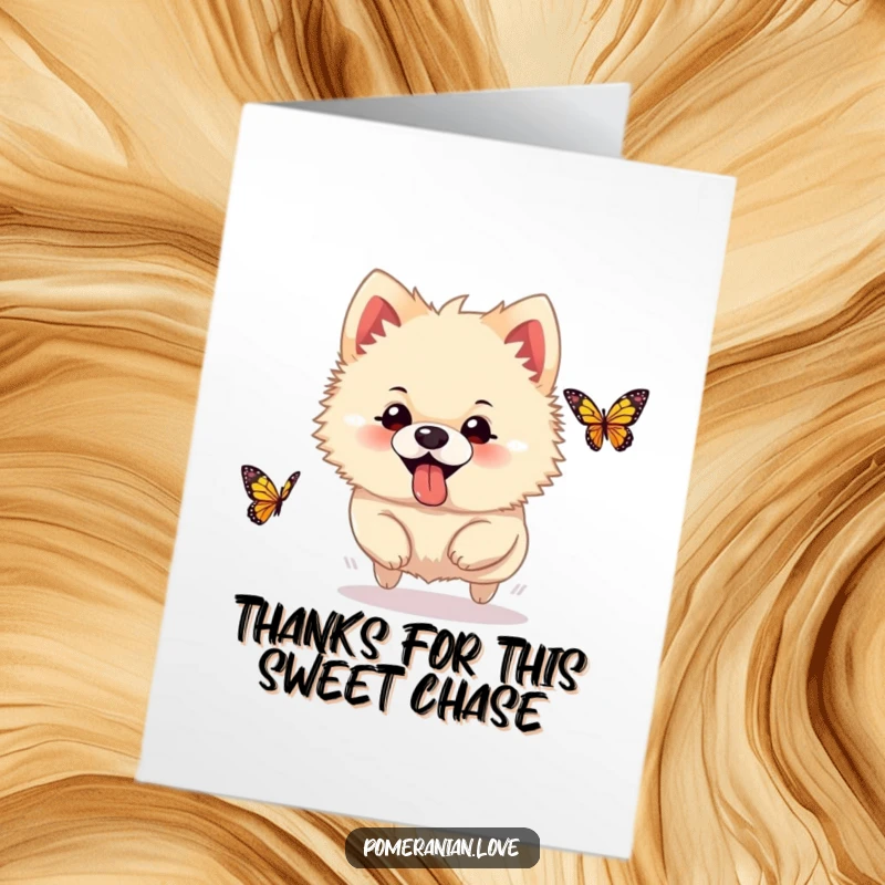 Funny Free Printable Thank You Card showing a silly Pomeranian with its tongue out, gleefully chasing a butterfly, a symbol of happy gratitude.