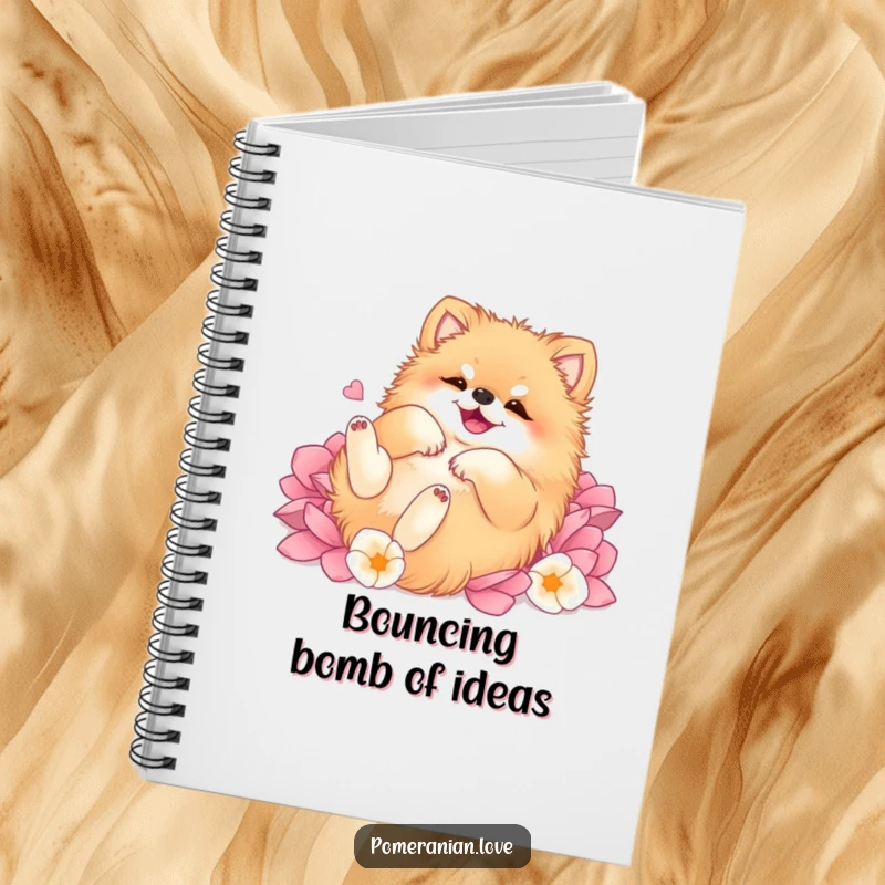 Funny Pomeranian notebook cover, depicting a dog rolling on its back with sheer happiness amidst a soft, lush field of flower petals.