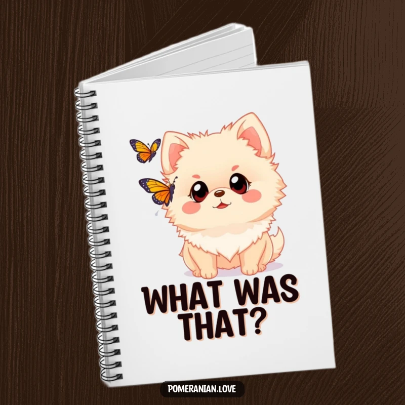 Funny Pomeranian notebook with a dog with wide eyes watching a butterfly. Perfect for note-taking, adding a touch of wonder and curiosity.