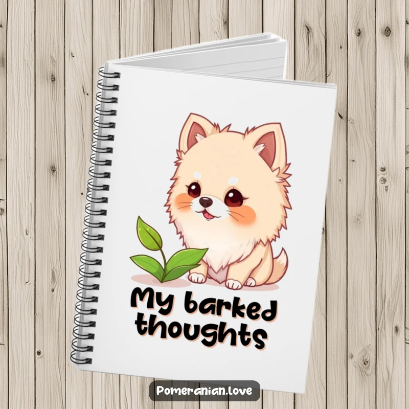 Funny notebook cover featuring a fuzzy-eared Pomeranian dog barking at a floating leaf, perfect for jotting down playful ideas.