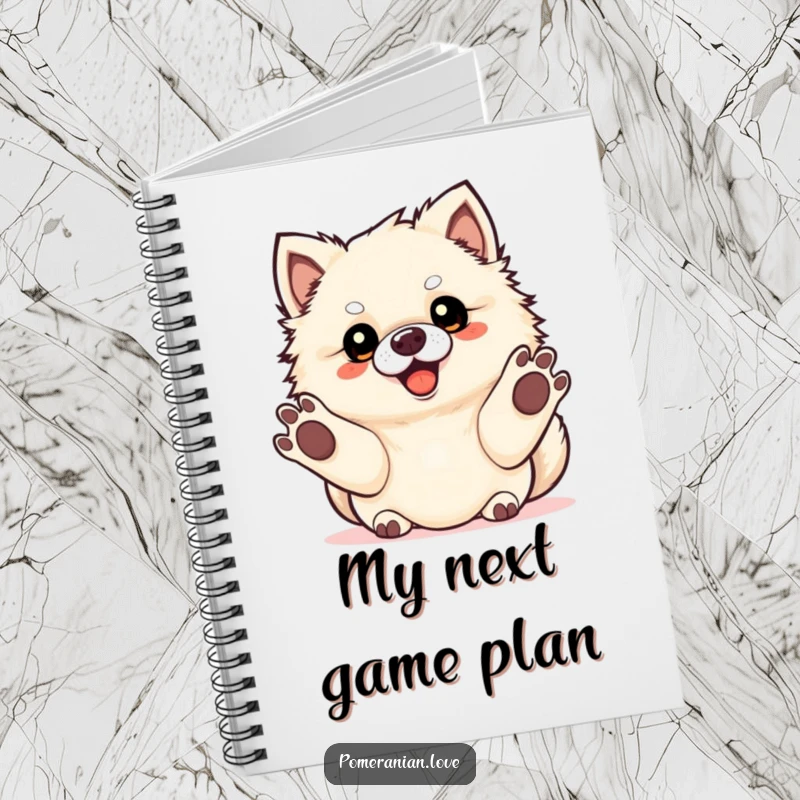 Funny Pomeranian dog with paws extended, ready for fetch, on a notebook cover.