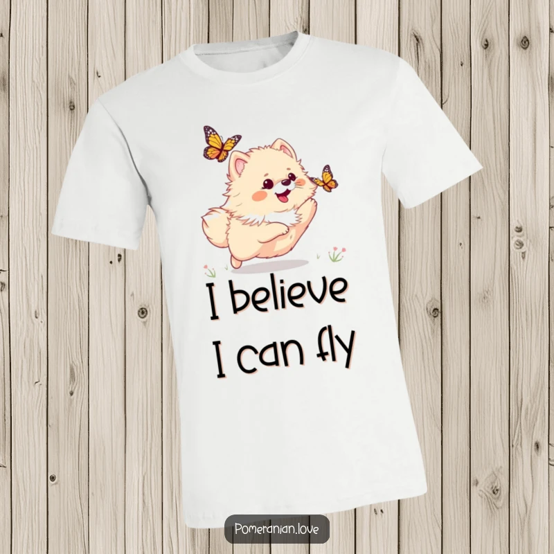 Funny t-shirt showcasing a happy Pomeranian dog mid-chase, playfully leaping after a fluttering butterfly in a vibrant setting.
