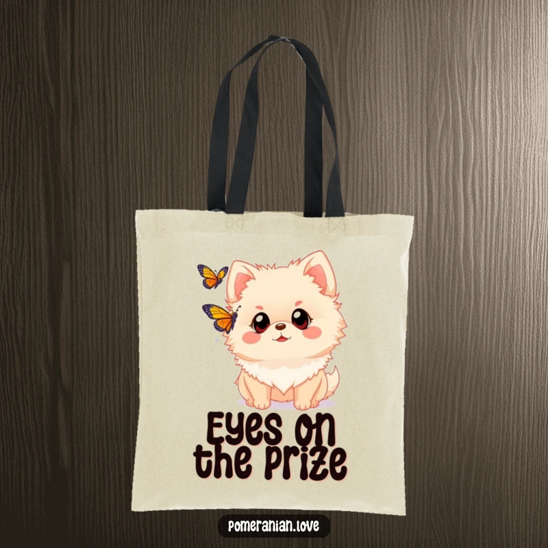 Funny Pomeranian tote bag with a dog with wide eyes watching a butterfly. Ideal for carrying items with a touch of wonder and nature appreciation.